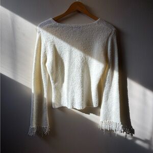 Elegant Cream Sweater with frayed sleeves